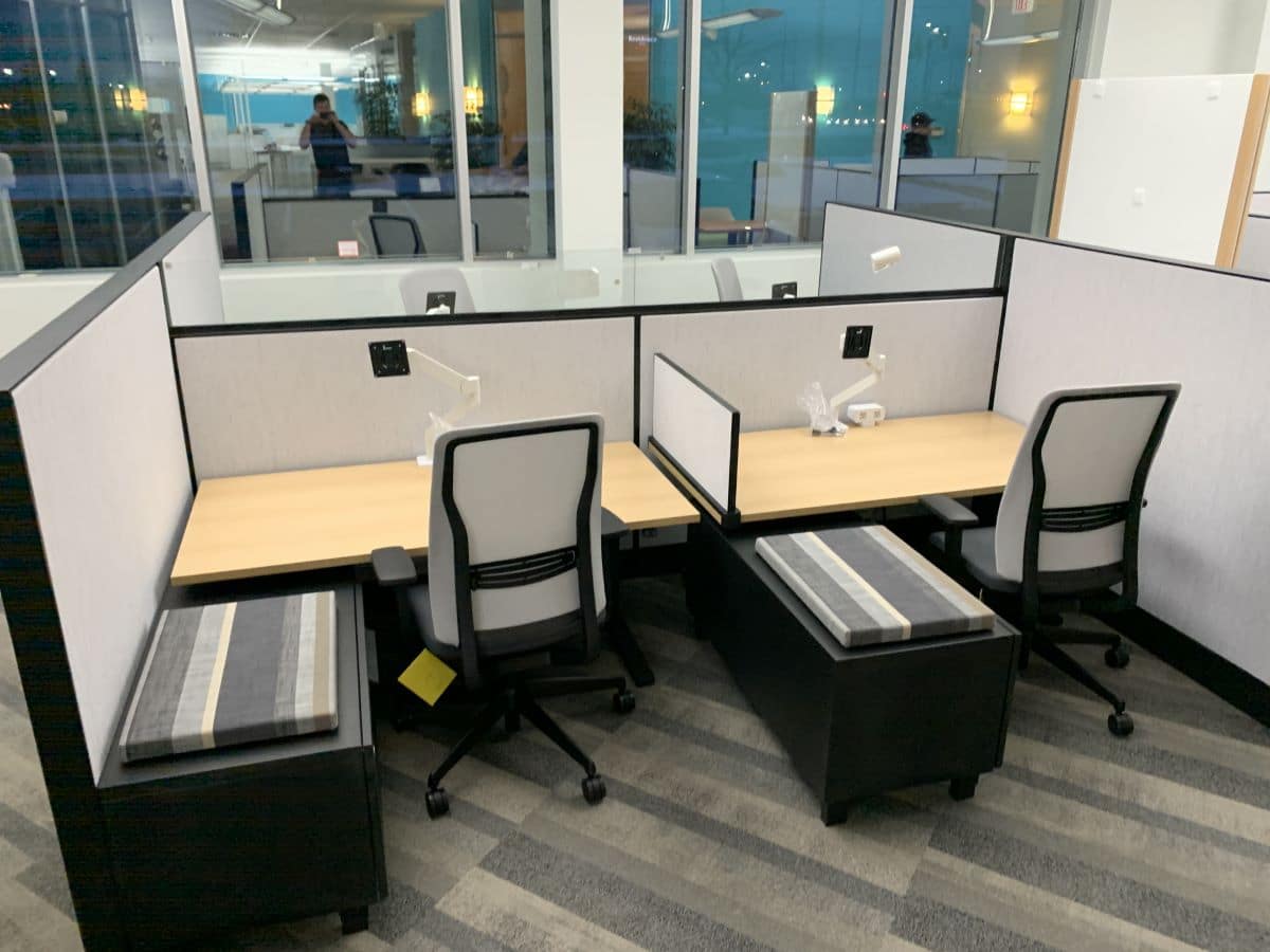 Open concept office furniture installation example - double cubicles with small wall in between